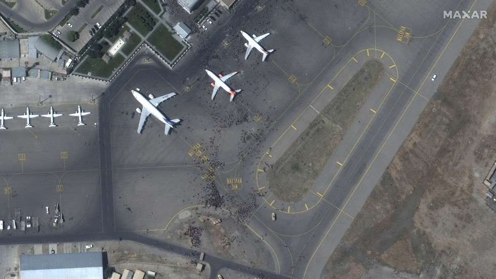 High-res satellite photos shows Kabul airport chaos as crowds of Afghans swarm runway in desperate effort to flee