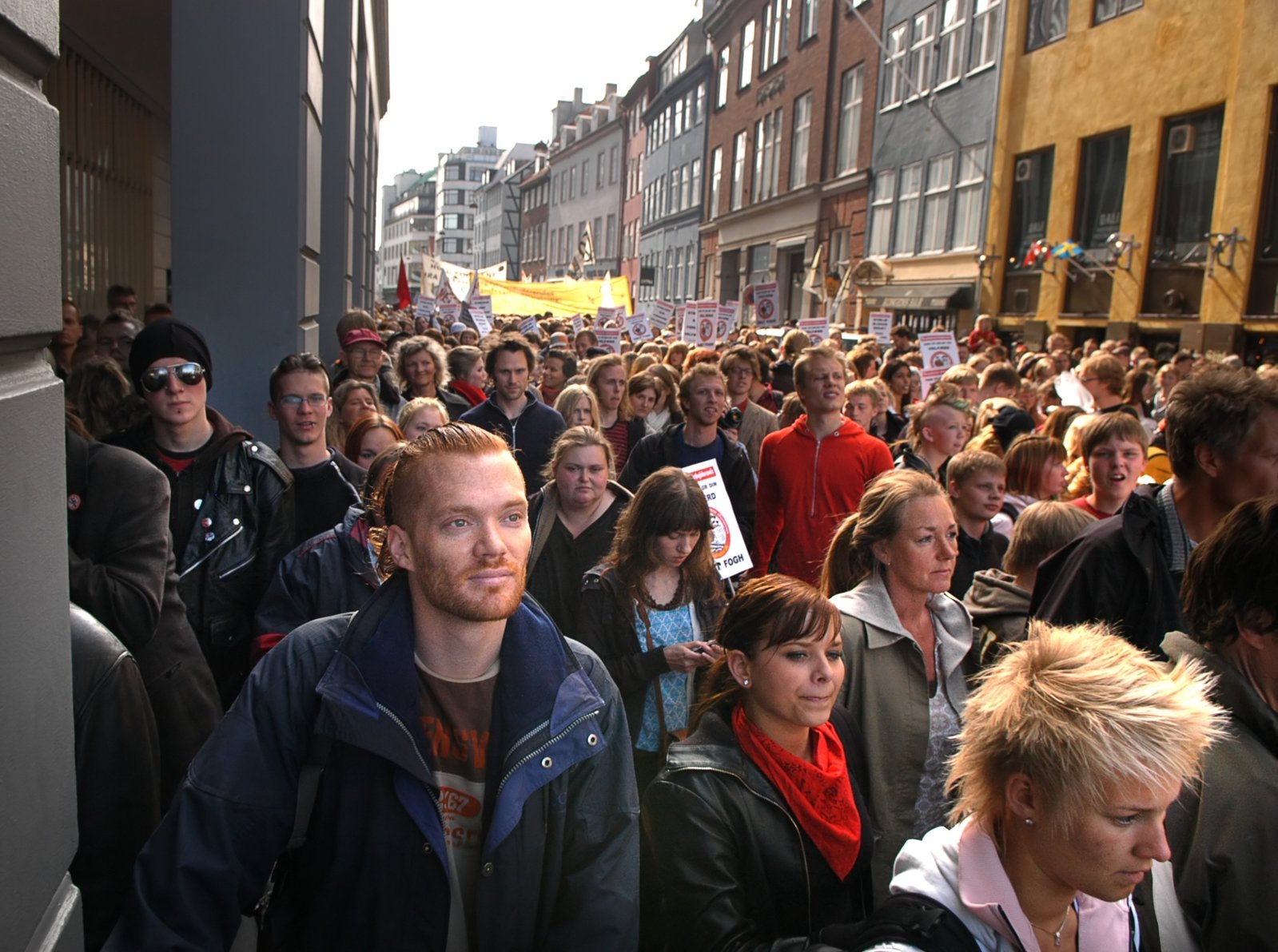Black-clad anti-lockdown demonstrators march through Copenhagen after activist receives 2-yr jail term