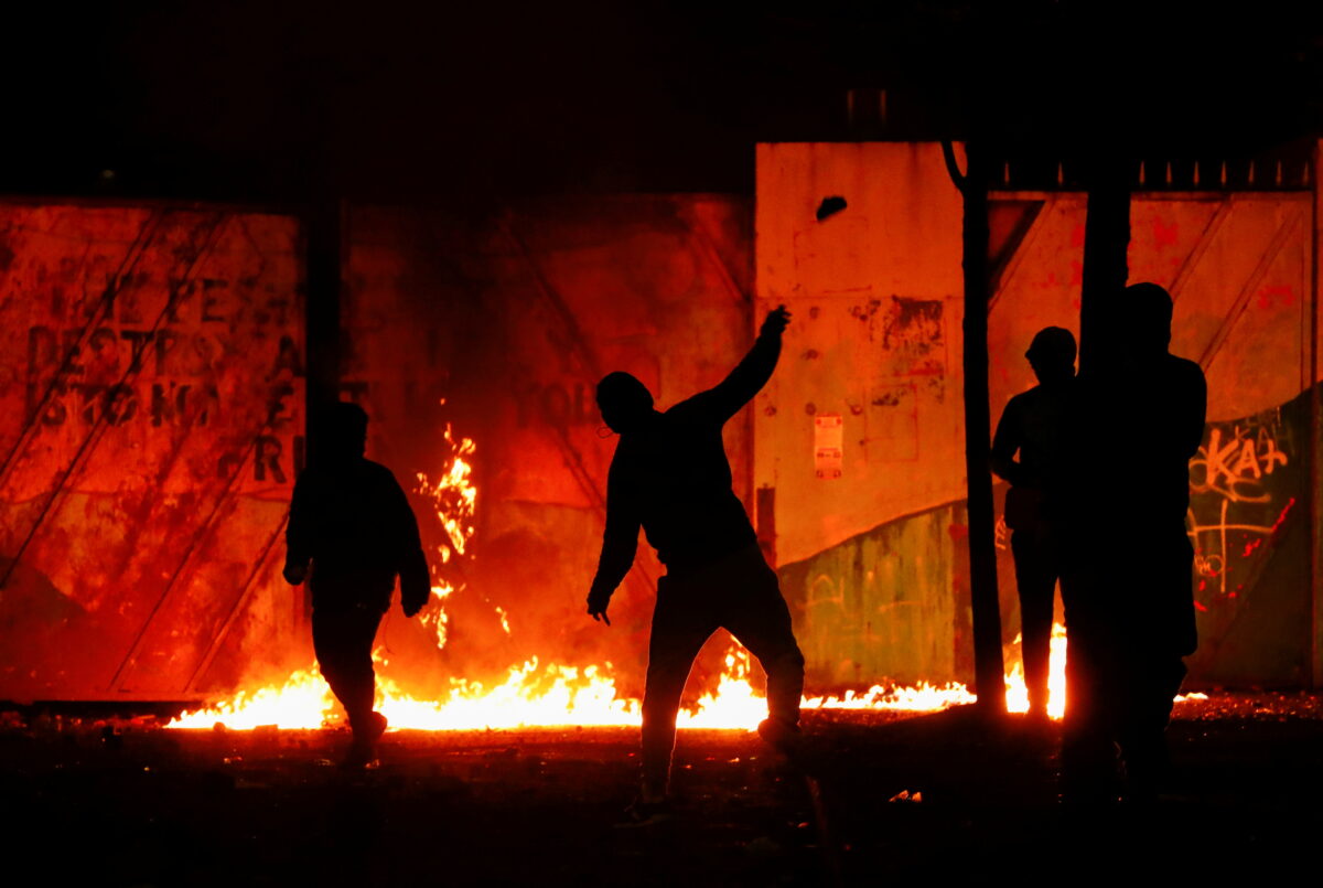 Belfast protests: Burning car rams into police line as nightly rioting continues