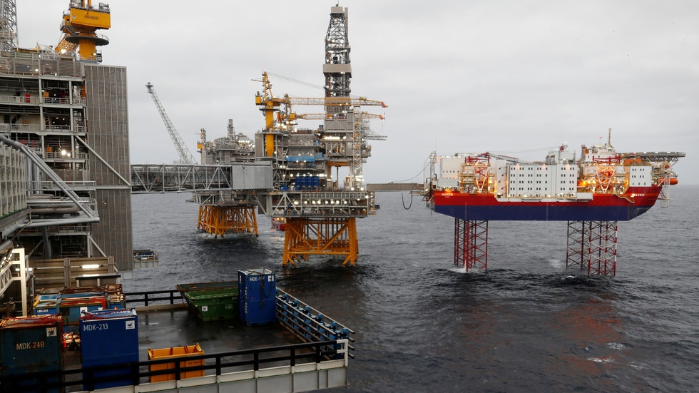 Oil climbs more than 4% as OPEC+ agrees record output cut